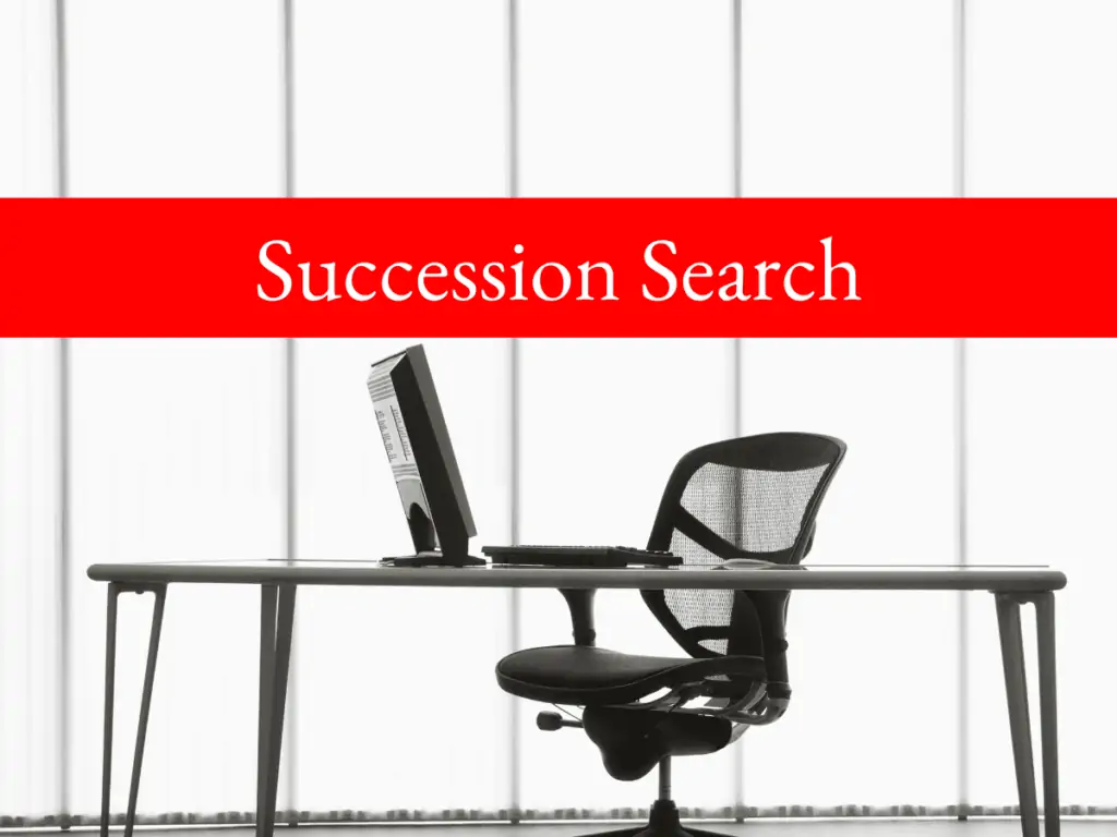 Photo of desk and empty chair with text Succession Search Featured Image 